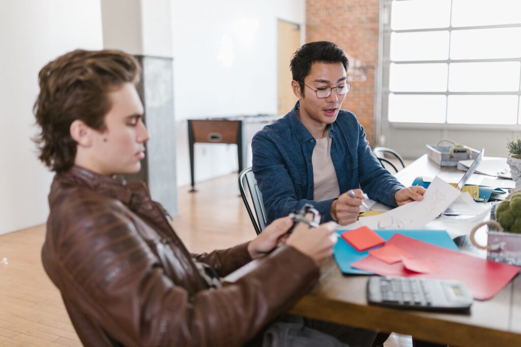 Startup team discussing profitable small business ideas